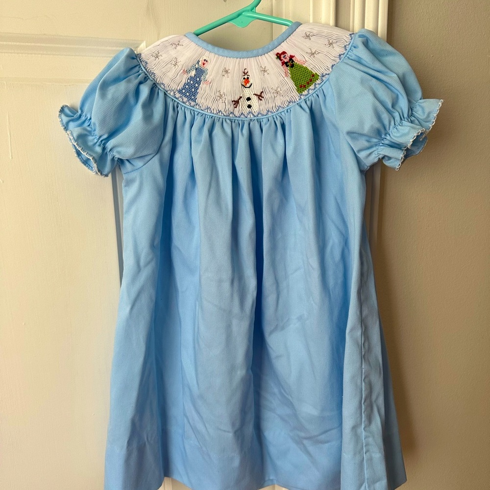 Disney’s Frozen inspired smocked dress with Elsa, Olaf, and Anna.